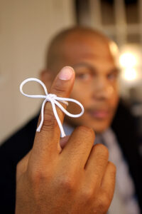 Man with string around his finger
