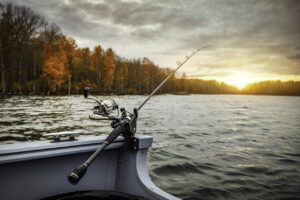 "fishing rod resting on a boat"