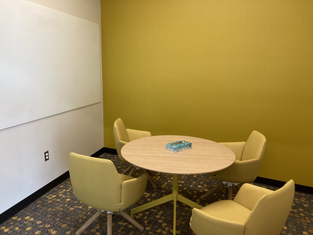 small meeting room with table and 4 chairs