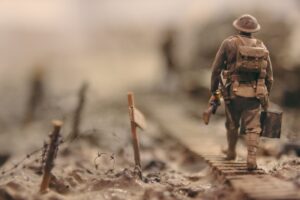 "a solider walking between trenches"