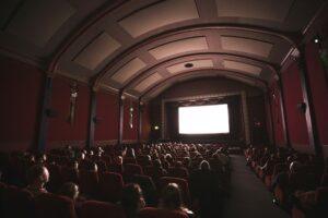 "a dark movie theatre"